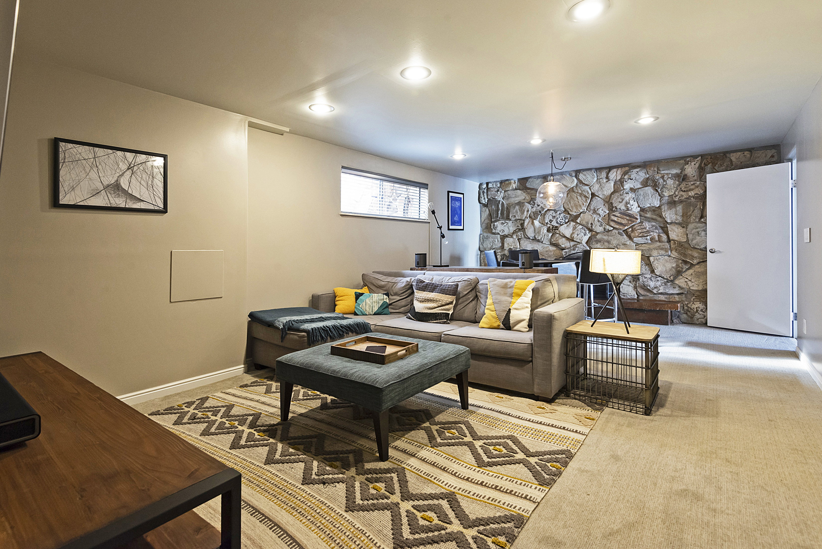 Living room featuring a fireplace, light colored carpet, and recessed lighting