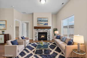 Living area featuring a fireplace and wood finished floors