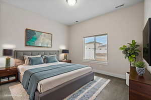 Carpeted bedroom with baseboards