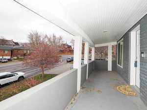 Covered porch with a residential view