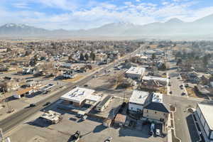 Aerial perspective of suburban area featuring a mountain backdrop