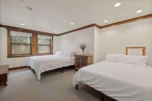 Bedroom featuring carpet flooring, recessed lighting, and ornamental molding