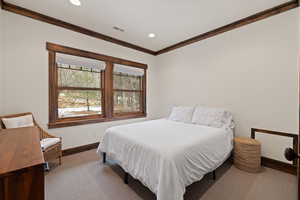 Bedroom with carpet, ornamental molding, and recessed lighting