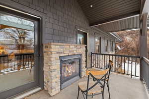 Master patio/terrace with an outdoor stone fireplace