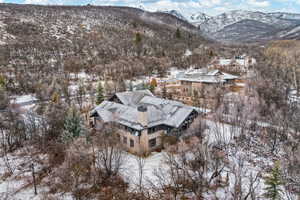 Snowy aerial view featuring a mountain view