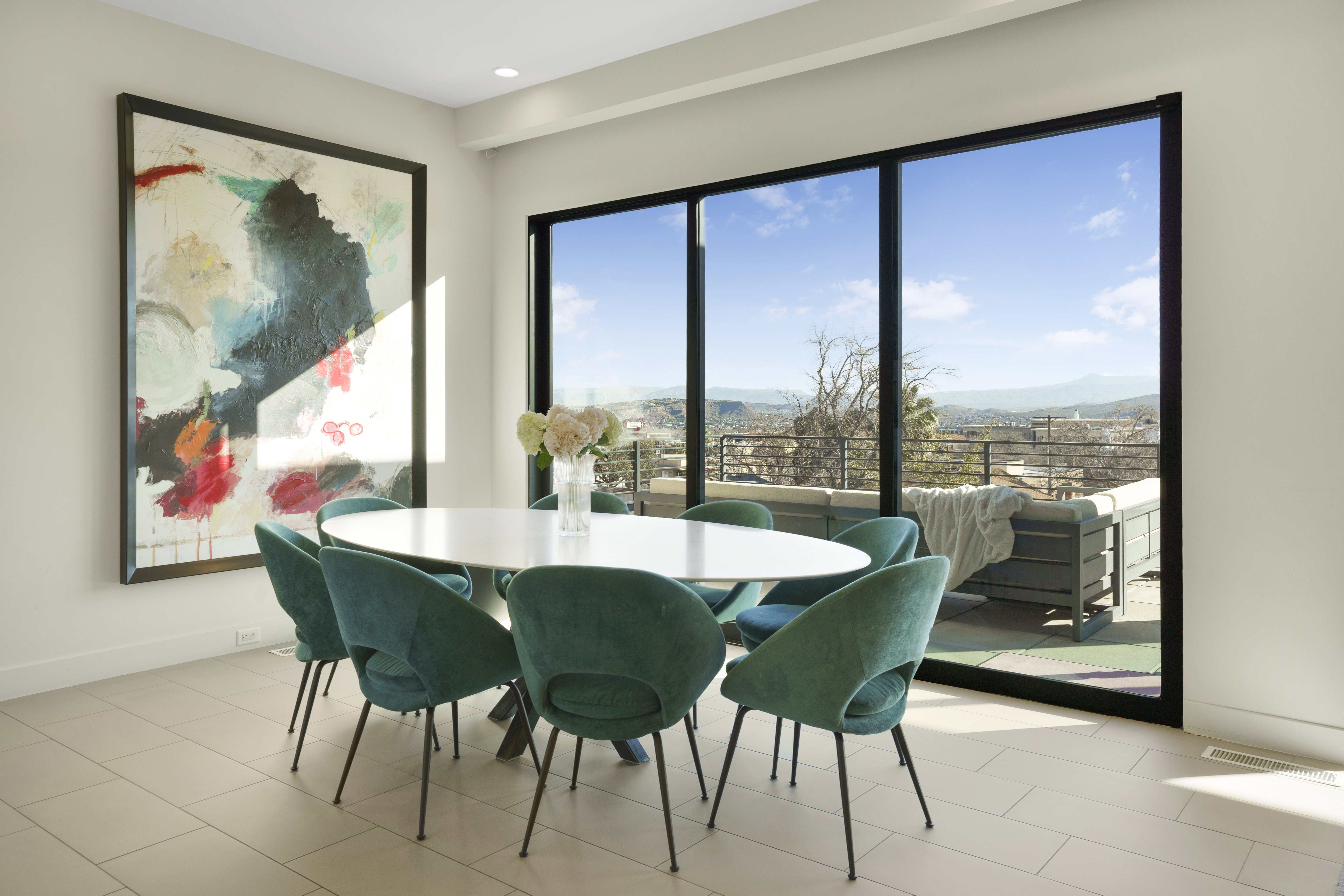 Dining area featuring baseboards and a mountain view