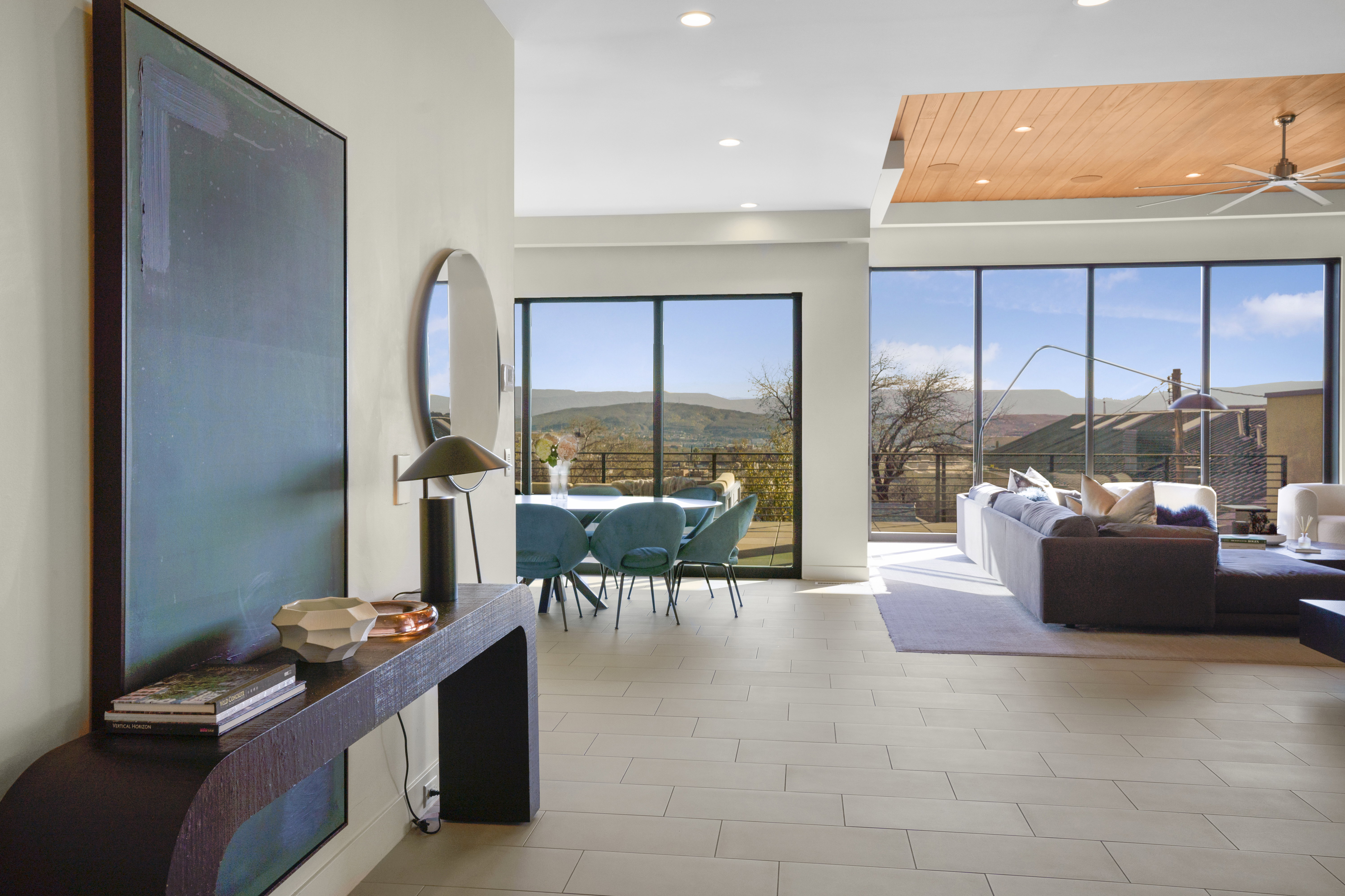 Living room with a mountain view, recessed lighting, and a ceiling fan