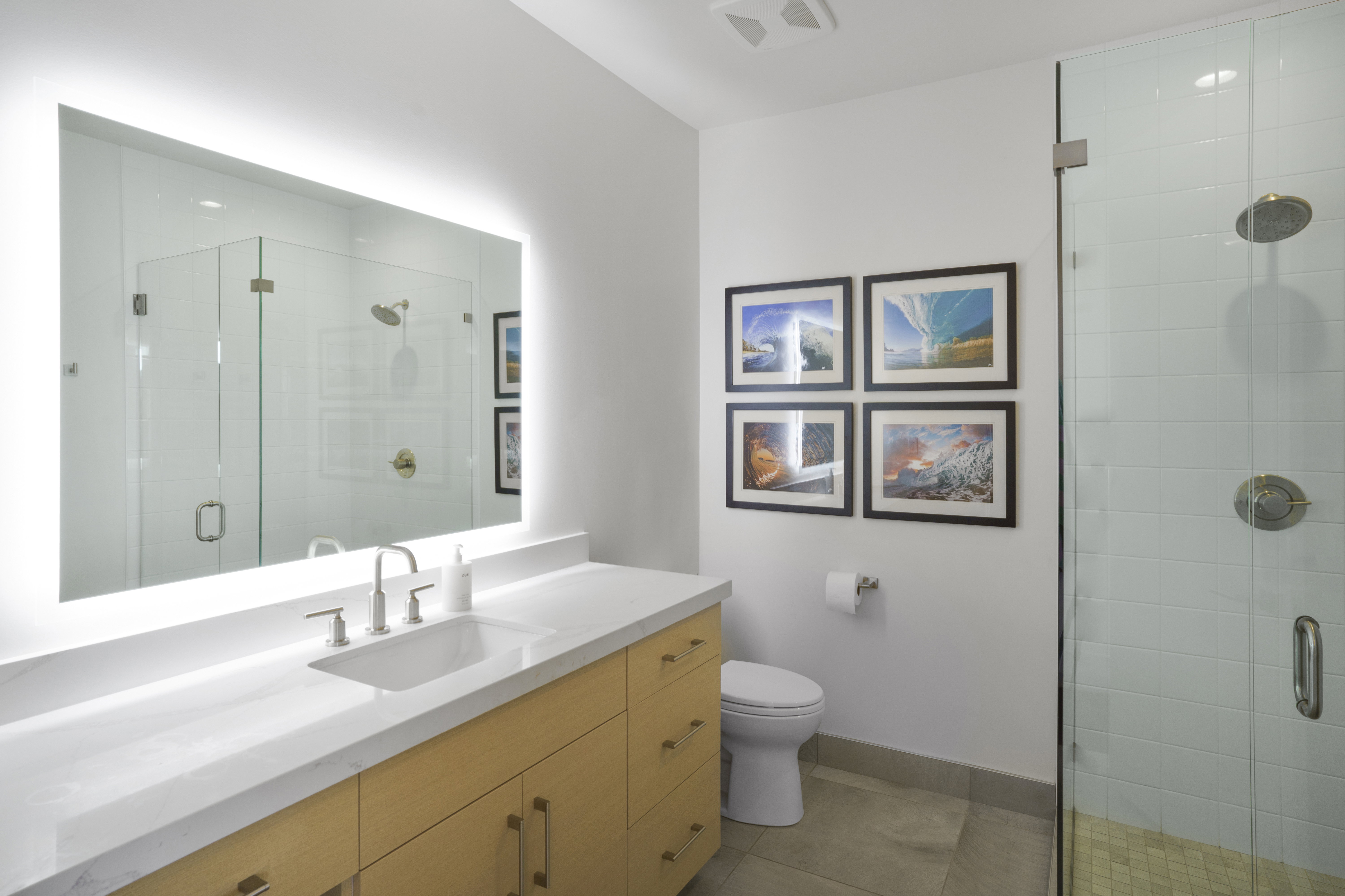 Bathroom featuring vanity, a stall shower, and light tile patterned floors