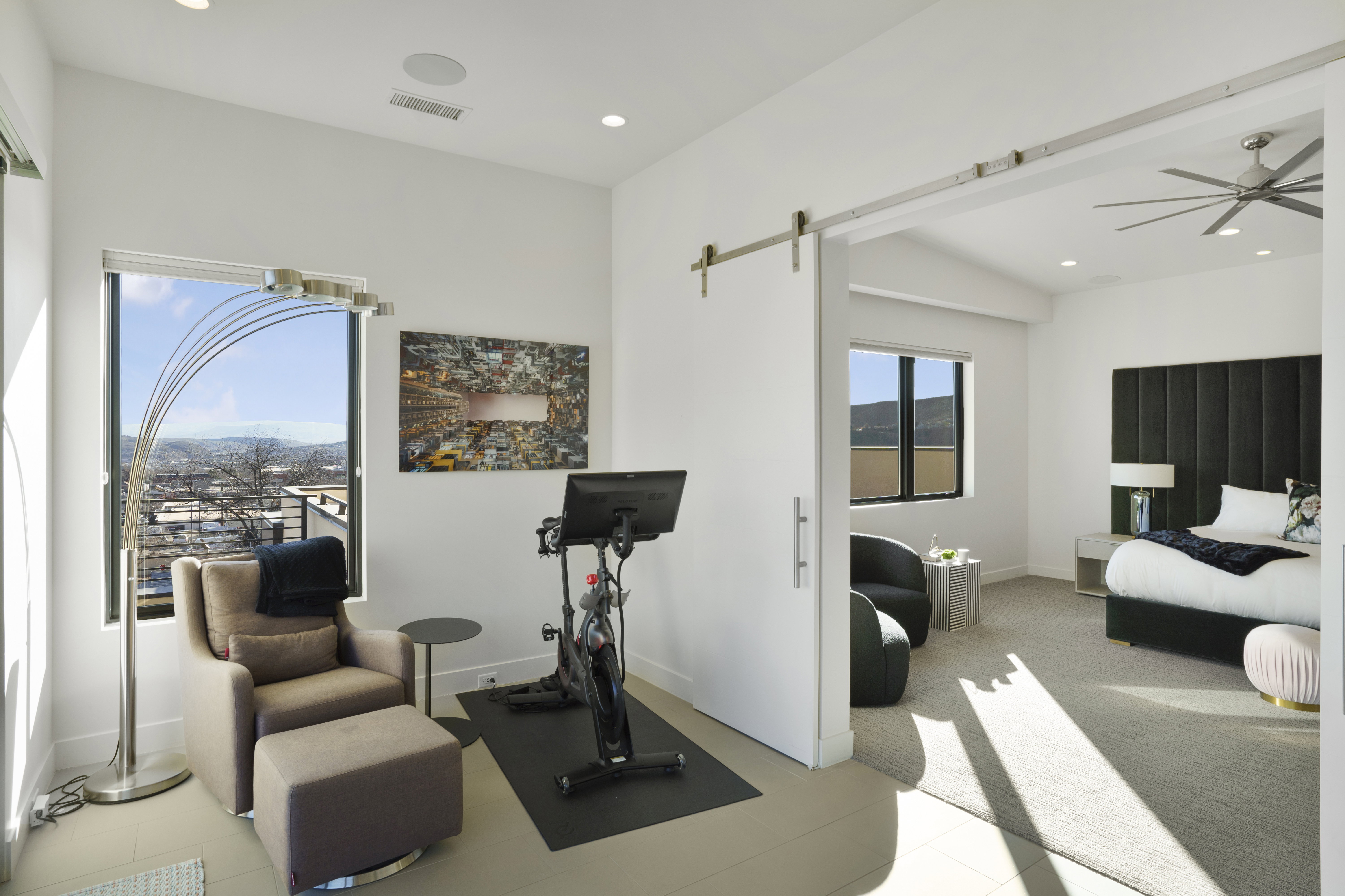 Workout area with a barn door, ceiling fan, and recessed lighting
