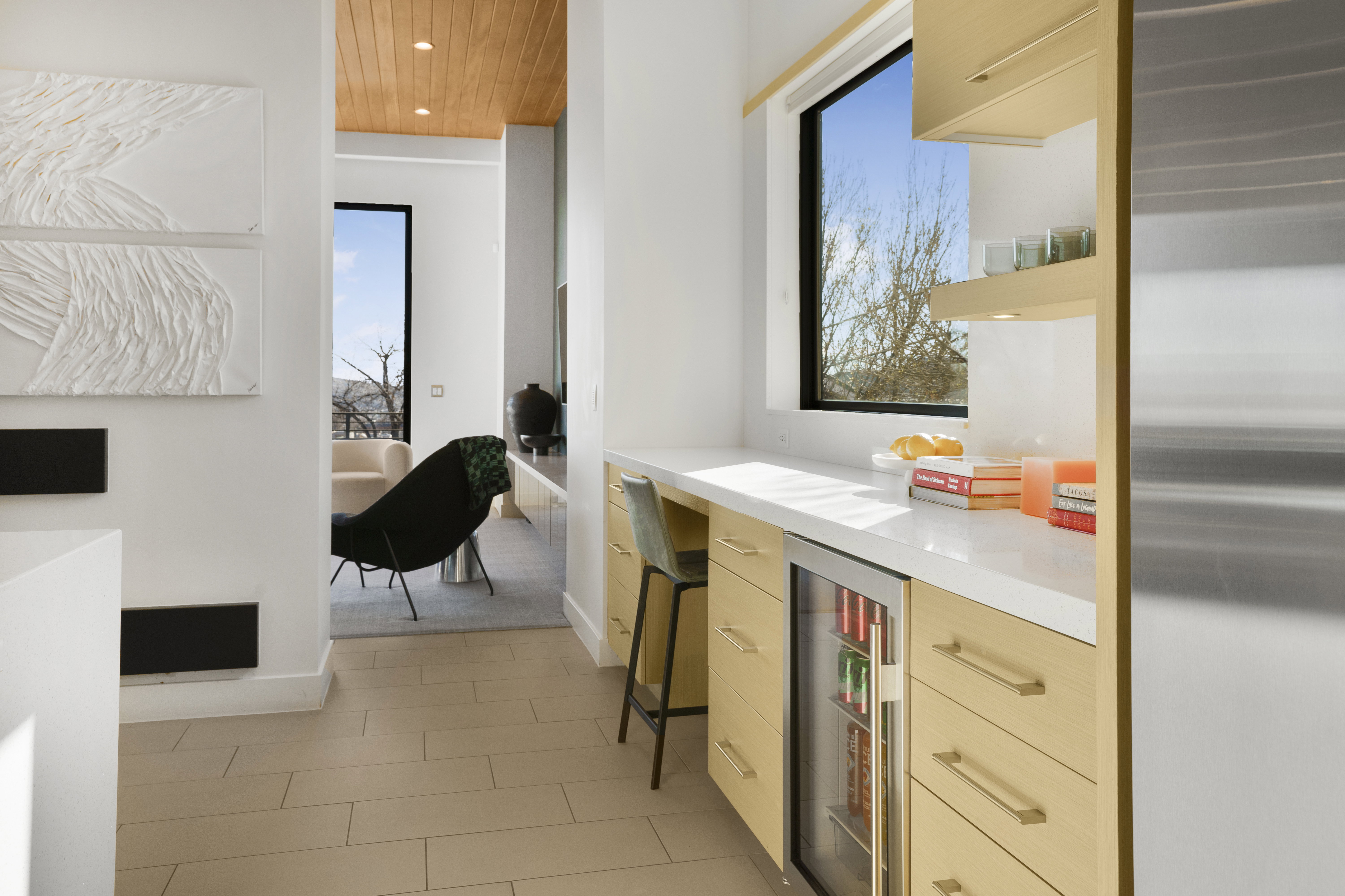 Bar with open shelves, beverage cooler, stainless steel fridge, light wood finish cabinetry, and wood ceiling