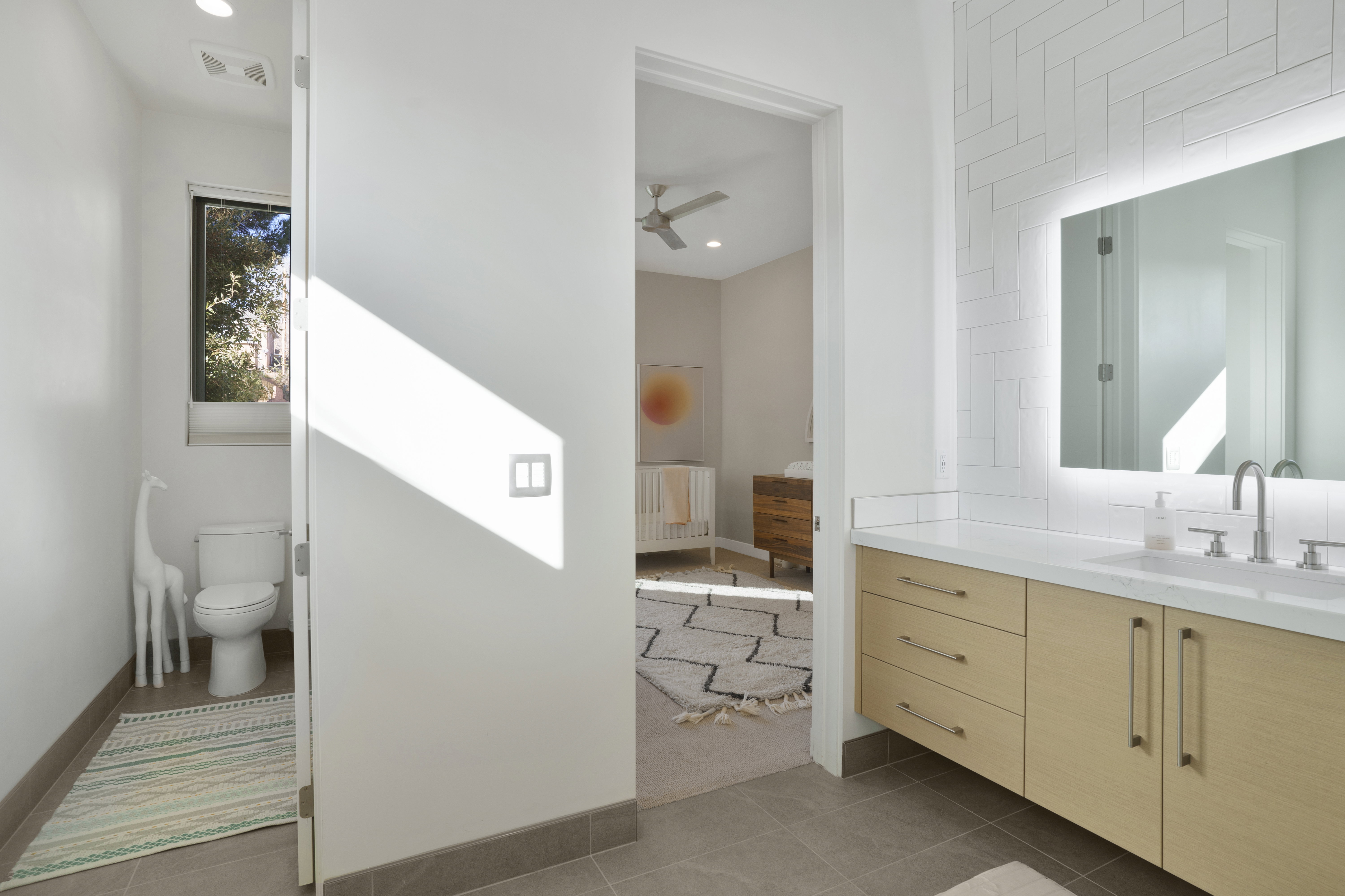 Bathroom with vanity, dark tile patterned flooring, a ceiling fan, and recessed lighting