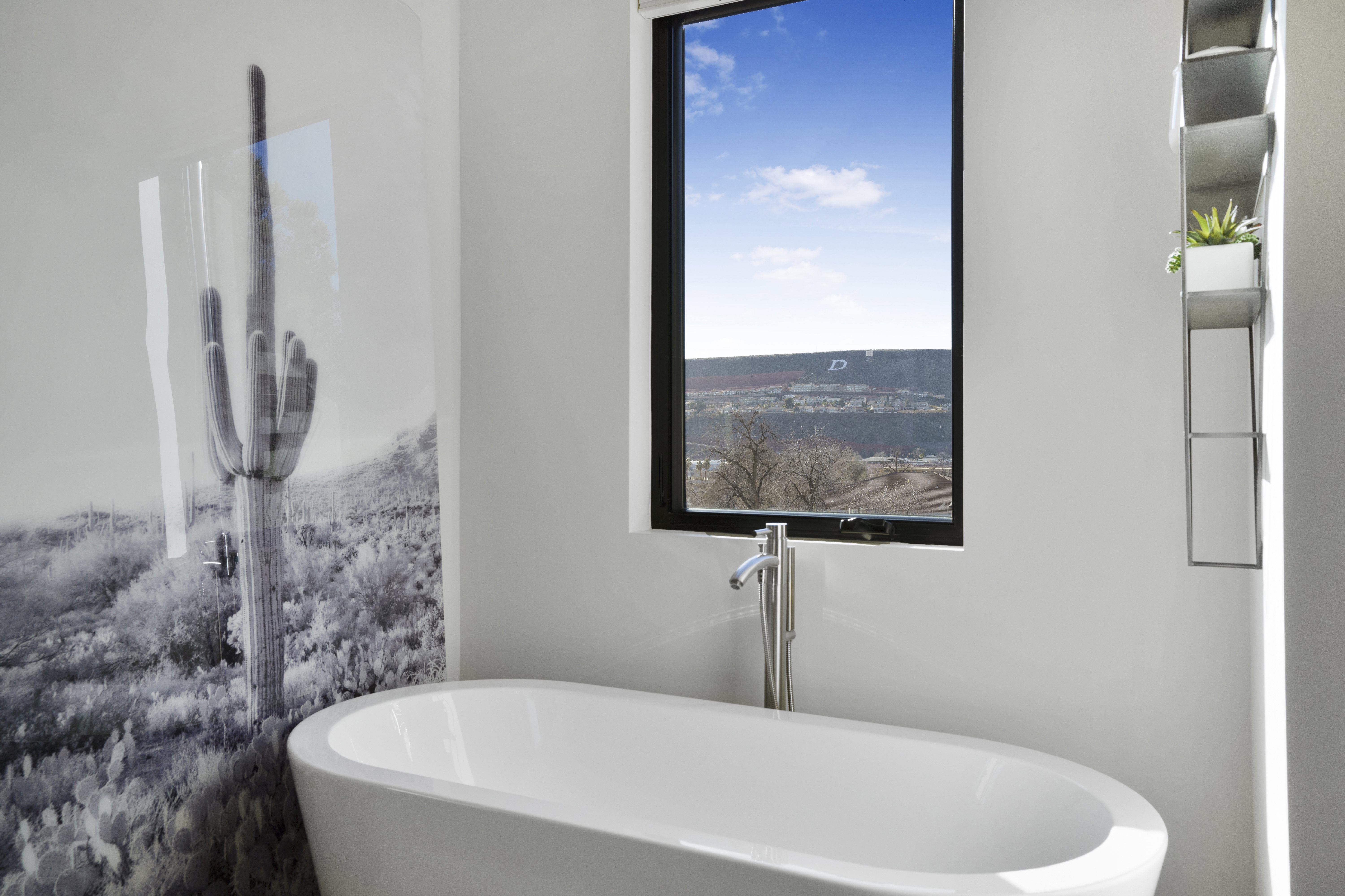 Bathroom with a soaking tub and plenty of natural light