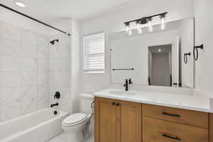 Full bathroom featuring shower / tub combination and vanity