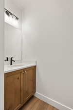 Bathroom with vanity and light wood finished floors