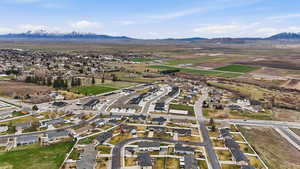 Aerial perspective of suburban area featuring a mountainous background