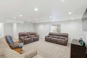 Living area featuring carpet floors and recessed lighting
