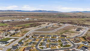 Aerial perspective of suburban area with a mountain backdrop