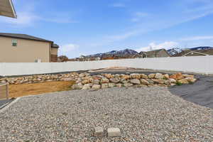 Fenced backyard with a mountain view and a residential view