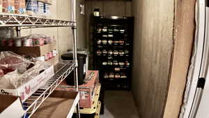Wine room featuring concrete floors