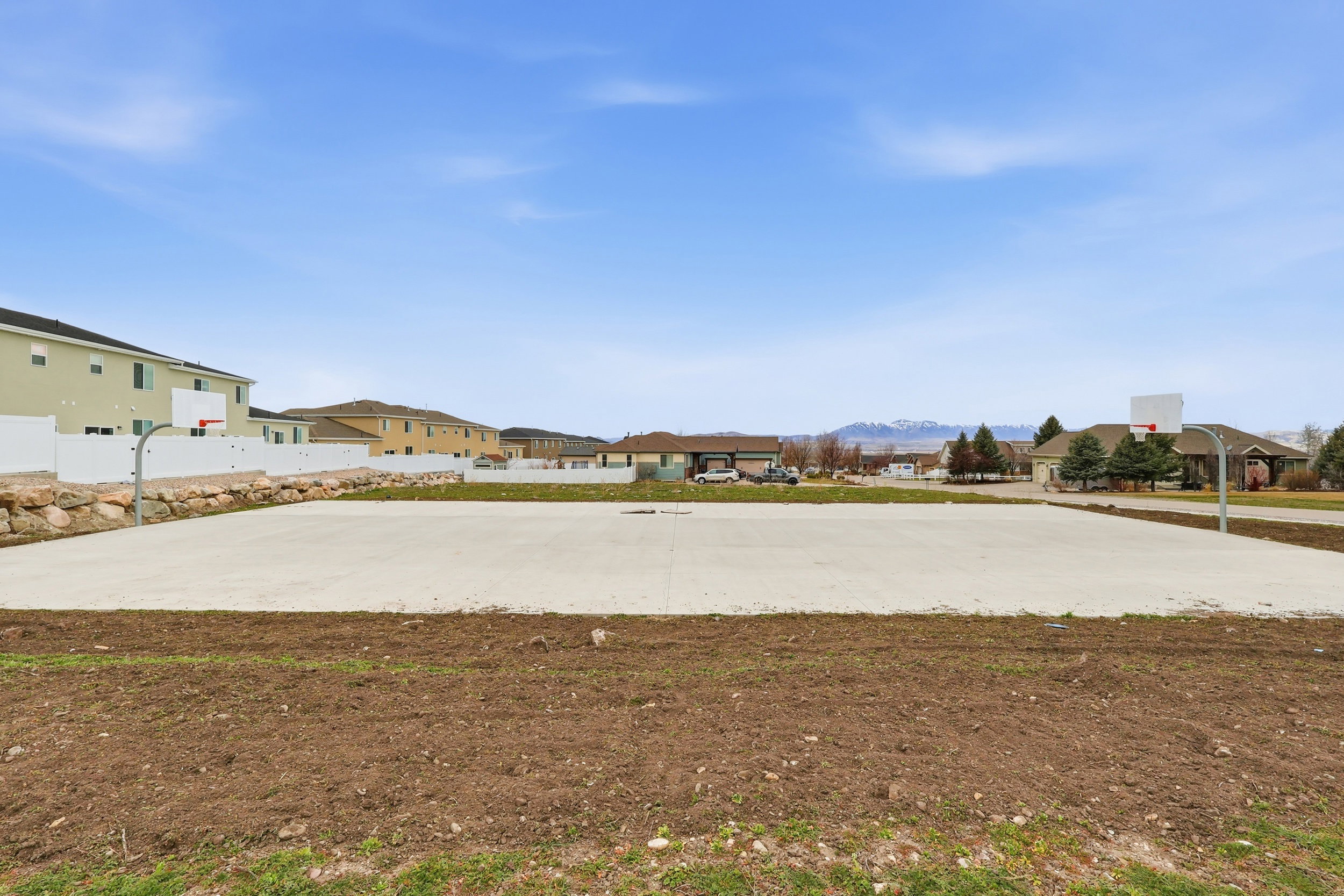 Surrounding community with community basketball court and a residential view
