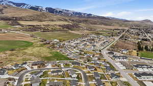 Aerial view of residential area featuring a mountainous background
