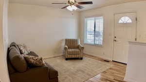 Entryway featuring light wood finished floors and a ceiling fan