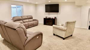 Living room with recessed lighting and carpet