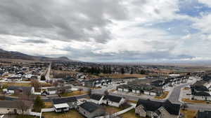 Aerial view of residential area featuring mountains