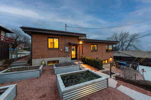 View of back facade with vegetable & herb garden boxes