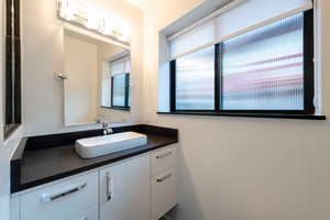 Bathroom with marble vanity