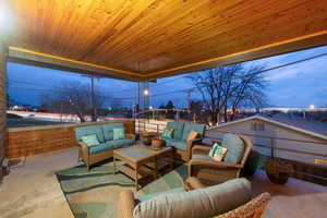 Patio terrace at dusk featuring a patio area and an outdoor lounge area