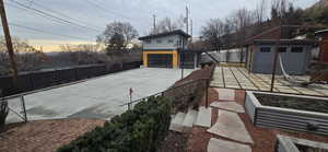 View of patio / terrace with an outbuilding and a detached garage