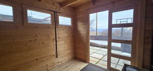 Norwegian shed with solid white pine wooden floors and a wood ceiling with exposed beams