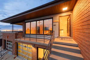 Exterior entry at dusk featuring porch area