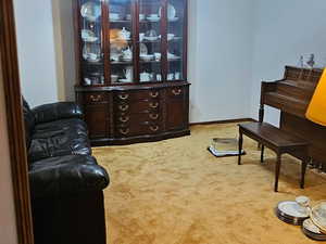 Living Room wraps around for a piano area