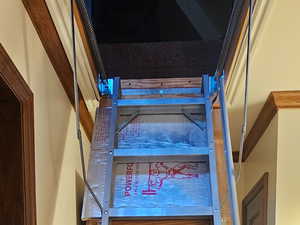 View of staircase to attic room