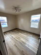 Unfurnished room featuring light wood finished floors and a ceiling fan