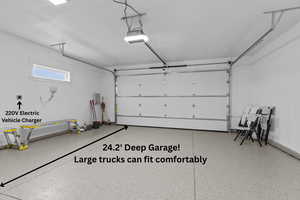 Garage featuring a garage door Epoxy Floor - 2 Car Extra Deep Garage