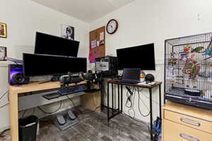Office space with dark wood finished floors