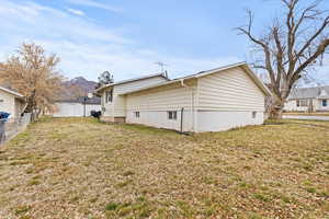 View of side of property with a mountain view