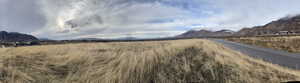 View of mountain backdrop with rural landscape