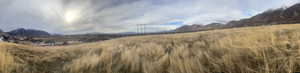 View of mountain backdrop featuring rural landscape