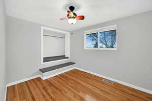 Unfurnished room with light wood-style flooring and a ceiling fan
