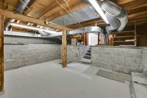 Unfinished below grade area featuring stairs