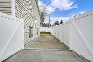 View of home's exterior featuring a patio and a fenced backyard