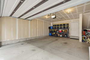 Deep Garage featuring a garage door opener