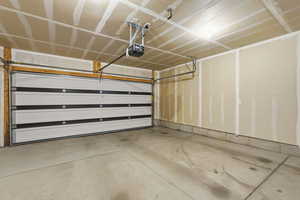 Deep Garage featuring a garage door opener