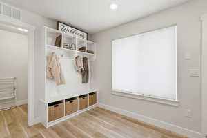 Mudroom featuring light wood-style flooring