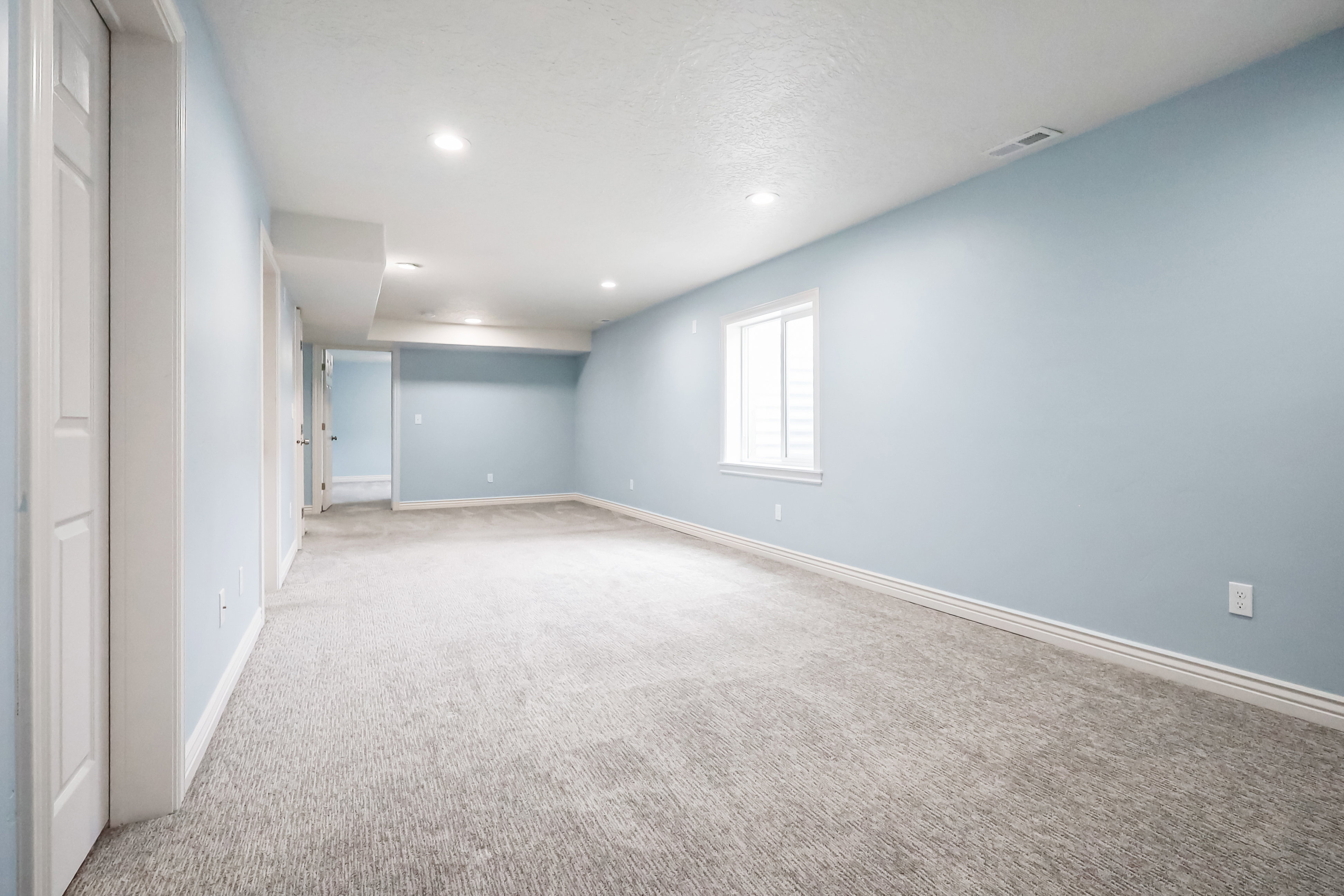 Basement featuring light carpet and recessed lighting