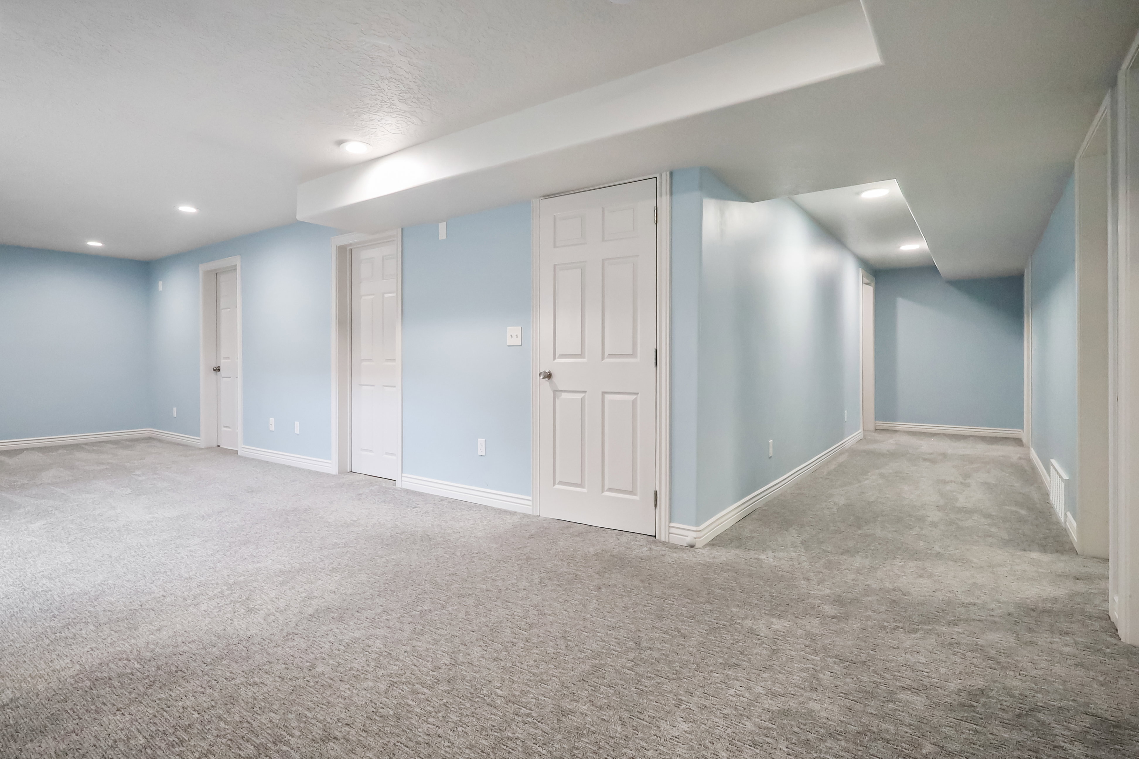 Finished basement featuring carpet and recessed lighting